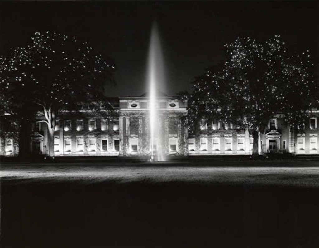 History of East Cleveland: NELA Park added to the National Register of Historic Places | Historic photo showing an illuminated fountain and buildings at night