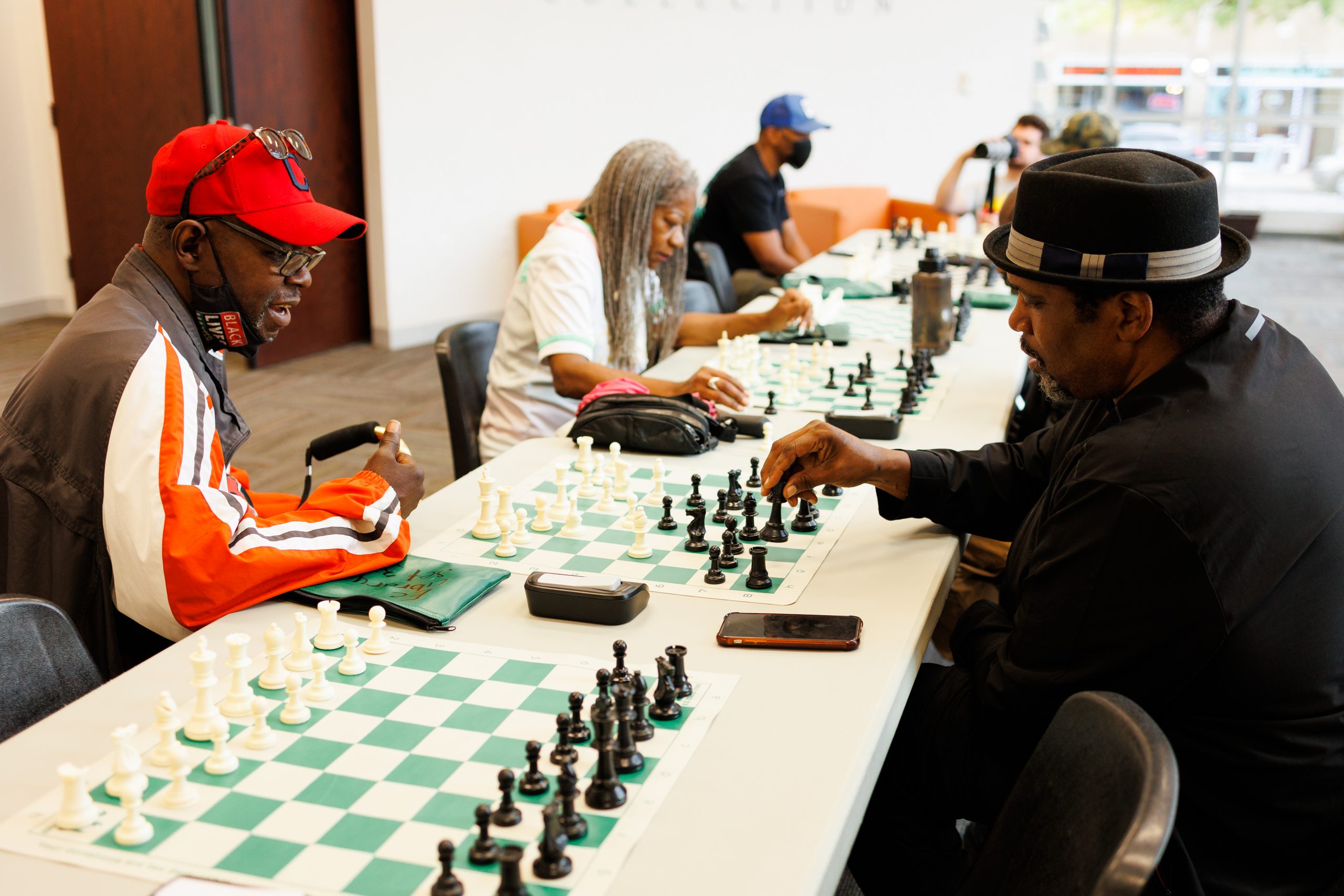 East Cleveland Events | Two African American men playing chess